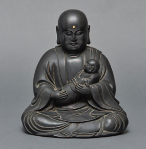 Amida Bouddha tenant un nourrisson 