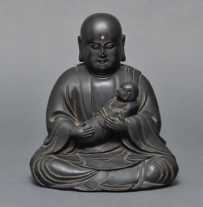 Amida Bouddha tenant un nourrisson